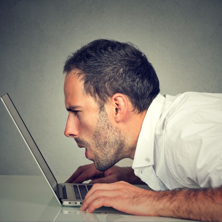 Man Staring at a Computer Screen
